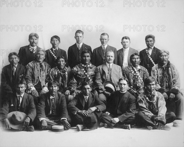 Judge James Wickersham in council with Indian chiefs, between 1900 and 1907. Creator: Unknown.