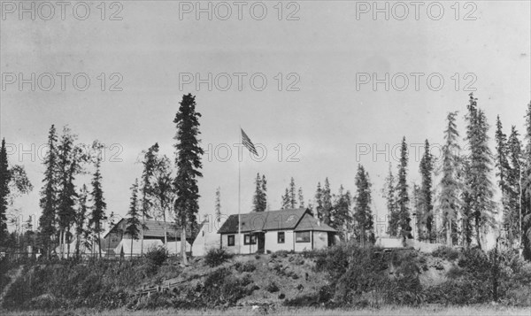 Building with American flag raised, between c1900 and 1916. Creator: Unknown.