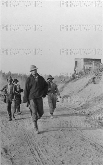 Men walking on dirt road, between c1900 and 1916. Creator: Unknown.
