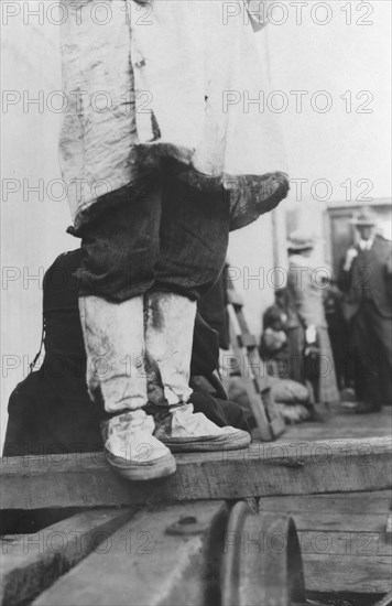 On a dock in Nome, between c1900 and 1916. Creator: Unknown.