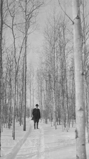 Rev. Burgess on snow covered road, between c1900 and 1927. Creator: Unknown.