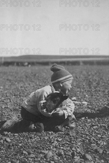 Child and calf, between c1900 and c1930. Creator: Unknown.