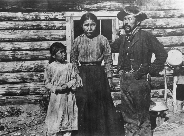 Eskimo father, mother and child, between c1900 and c1930. Creator: Unknown.