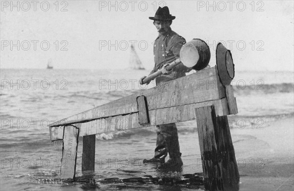 Miner washing gold, between c1900 and c1930. Creator: Unknown.