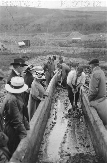 Taking gold from Chatanika, sluice-box, between c1900 and c1930. Creator: Unknown.