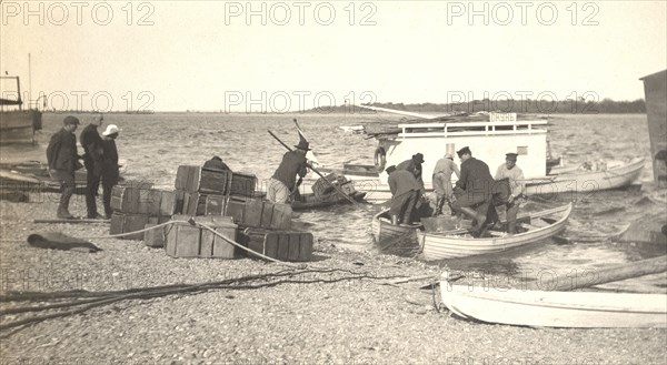 Unloading gasoline from boats on the Zee River during windy conditions, 1909. Creator: Vladimir Ivanovich Fedorov.