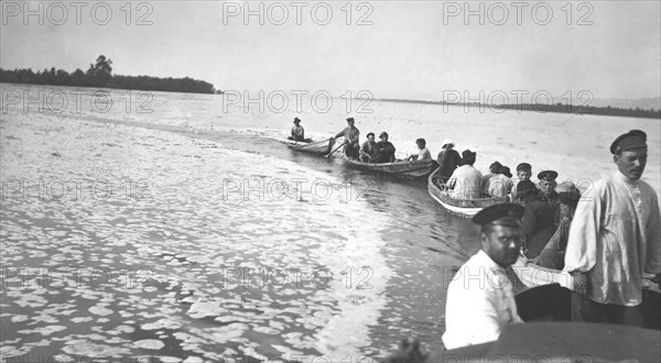 A caravan of boats from a survey party on the Zeya River during a flood, 1909. Creator: Vladimir Ivanovich Fedorov.