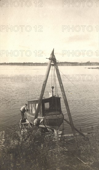 Repair of the boat "Mana" on the banks of the Zeya River, 1909. Creator: Vladimir Ivanovich Fedorov.
