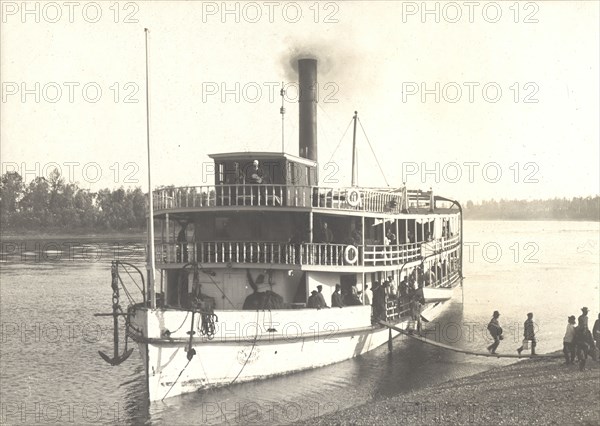 Disembarkation of passengers from the steamship "Russian" on the shore near the...Ovsyanki, 1909. Creator: Vladimir Ivanovich Fedorov.