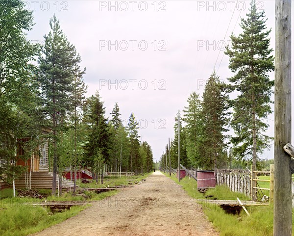 Factory lane and school, Kovzha [Russian Empire], 1909. Creator: Sergey Mikhaylovich Prokudin-Gorsky.