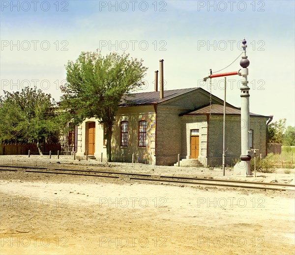 Railroad station with water crane and tracks, between 1905 and 1915. Creator: Sergey Mikhaylovich Prokudin-Gorsky.