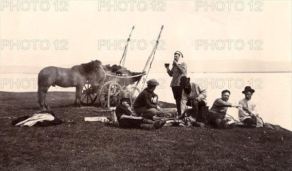 Picnic. Group of Men on the River Shore, 1900. Creators: I. A. Podgorbunskii, V. I. Podgorbunskii.