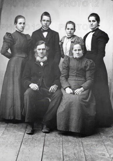 Studio portrait: "Sitting: Lispa Per, Karin Eriksson Standing from left Anna, Edvard..., 1890-1900. Creator: Lars Olsson Akerman.