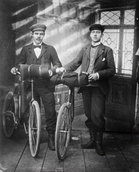 Cyclists in the studio; two men with bicycles, 1890-1910. Creator: Lars Olsson Akerman.