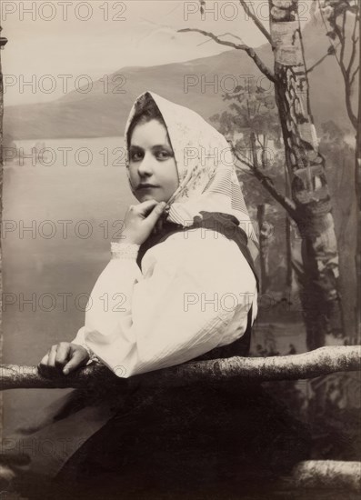 Photograph of a young girl in a white blouse and white headscarf, 1880-1890. Creator: Helene Edlund.