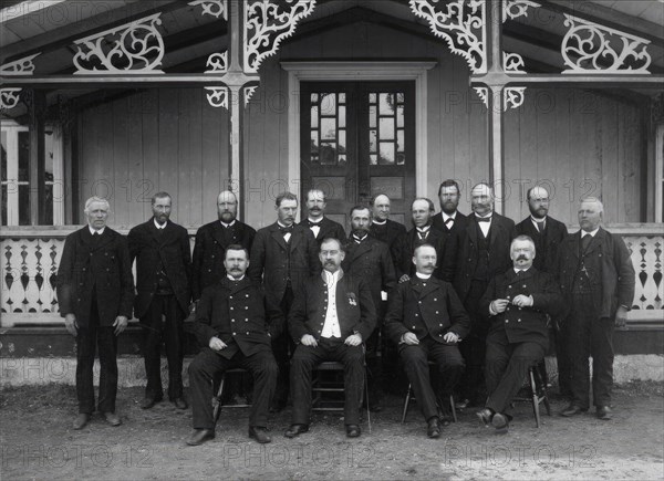 Judges, sheriffs and jurors gathered outside the courthouse for Västra Härad's trial...1900. Creator: Unknown.