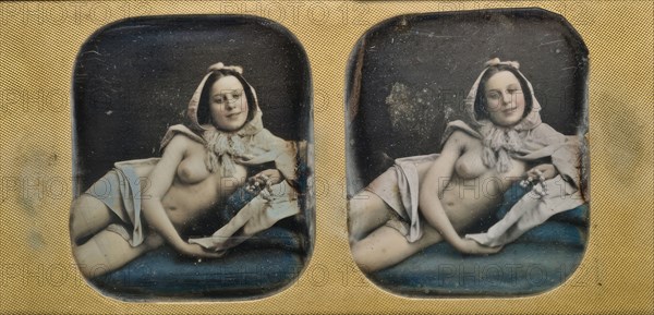 Young scantily clad woman, lying on her side.  Creator: Unknown.