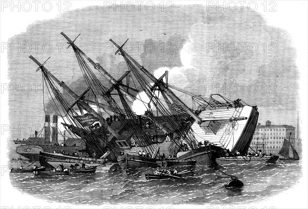 Raising the iron ship Ganges, sunk in the Thames off Shadwell, 1862. Creator: Unknown.