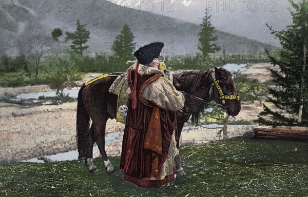 Altai Woman in National Costume (Hat: Kuaraan Boruk, Sheepskin Coat: Ton, Sleeveless..., 1911-1913. Creator: Sergei Ivanovich Borisov.