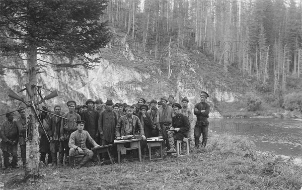 Group of Shoria Men with Members of the Land-Management Expedition, 1913. Creator: GI Ivanov.