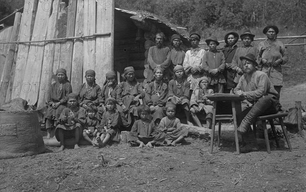 Inhabitants of One Gornaia Shoria Village and an Expedition Member, 1913. Creator: GI Ivanov.