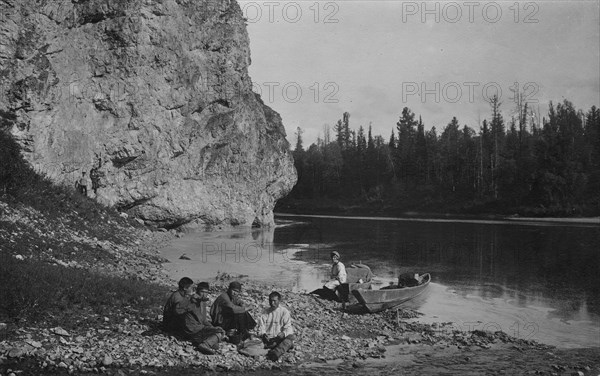 Members of the Expedition at Dinner on the Shore of the Mrassu River Near the Saga Ulus, 1913. Creator: GI Ivanov.