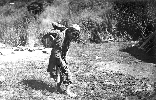 Shoria Woman Carrying a Load, 1913. Creator: GI Ivanov.