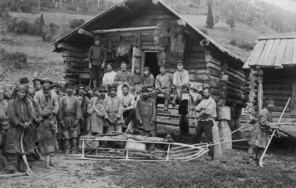 Group of Shoria Men; a Hunter, in Front, Equipped for a Winter Hunt by the Members..., 1913. Creator: GI Ivanov.