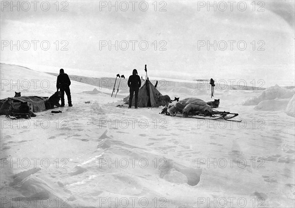 Members of a Sled Expedition near Their Tent, 1913. Creator: Mikhail Alekseevich Pavlov.