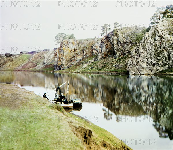 Upper Georgievskii Rock and a general view of the settlement of Utka, Chusovaya River, 1912. Creator: Sergey Mikhaylovich Prokudin-Gorsky.