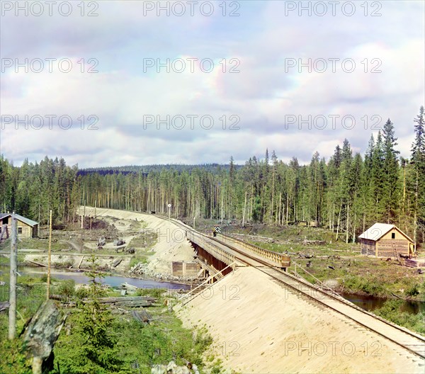 Railroad bridge across Kumsa River near the Medvezhya Gora Station, 1915. Creator: Sergey Mikhaylovich Prokudin-Gorsky.