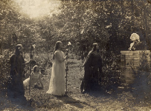 Briner sisters (from right to left) Nina, Maria, sitting on the ground Ekaterina Kornakova, 1914. Creator: Unknown.