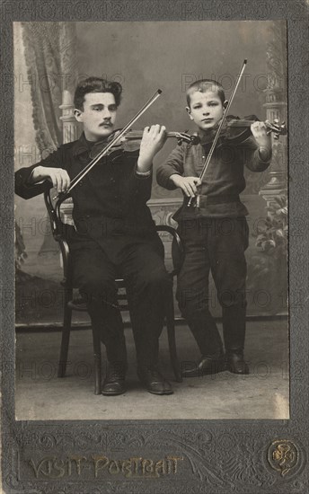 P.L. Stolyarov and V.P. Karetnikov playing violins, 1910-1919. Creator: I. F. Varlekhovskii.