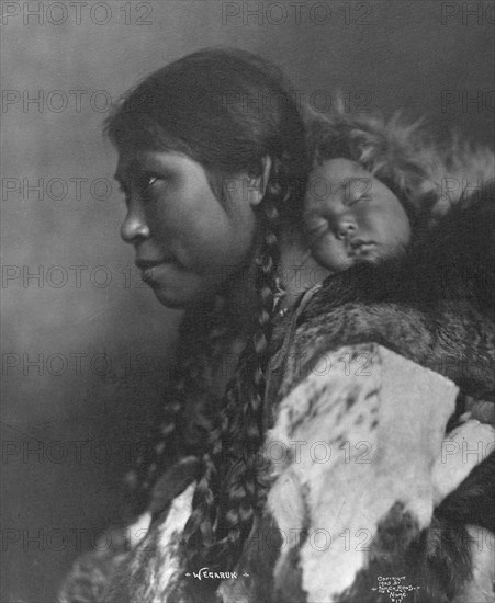 Eskimo mother and child , c1905, printed (1923?). Creator: Lomen Brothers.