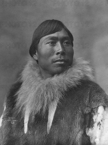 Eskimo posing , c1903, printed (1927?). Creator: Lomen Brothers.