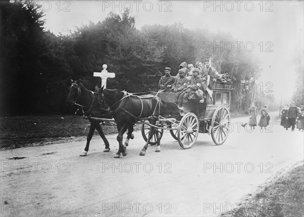 Red Cross Transport in Forest of Laigle (i.e., Laigne), 1914. Creator: Bain News Service.