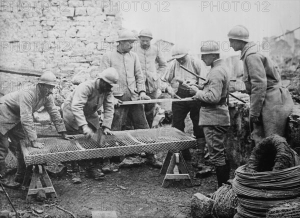 Poilus making mattresses, between c1915 and c1918. Creator: Bain News Service.