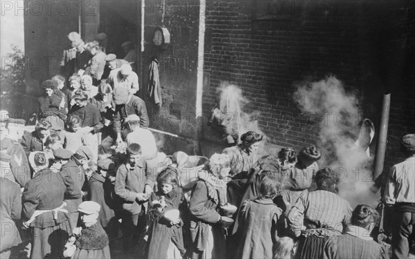 Poor in North France fed from German field kitchen, between c1914 and c1915. Creator: Bain News Service.