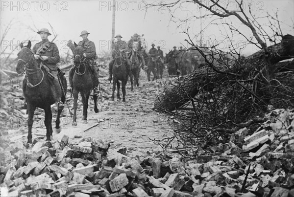 British Cavalry passing thro' wrecked village, 21 Apr 1917.. Creator: Bain News Service.