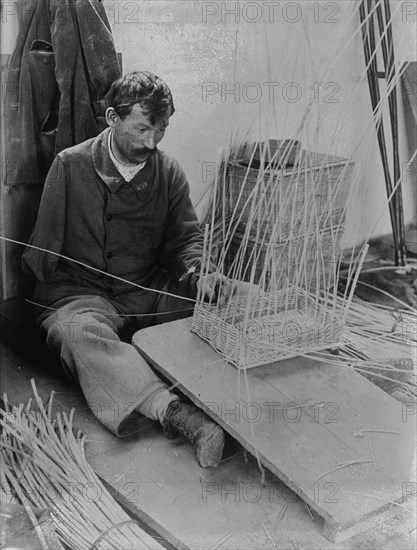 Fernand Bihery [making baskets, French School for crippled soldiers], 1918. Creator: Bain News Service.