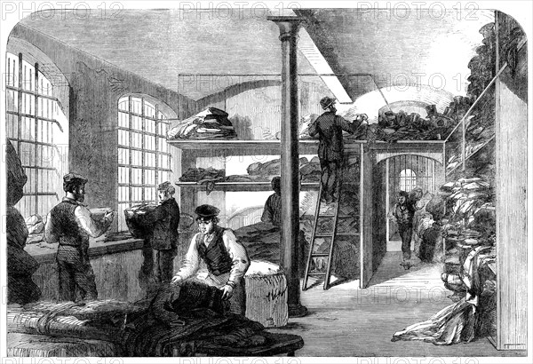 The Cotton Famine: receiving clothes at Bridewell Hospital...for the distressed operatives, 1862. Creator: Unknown.