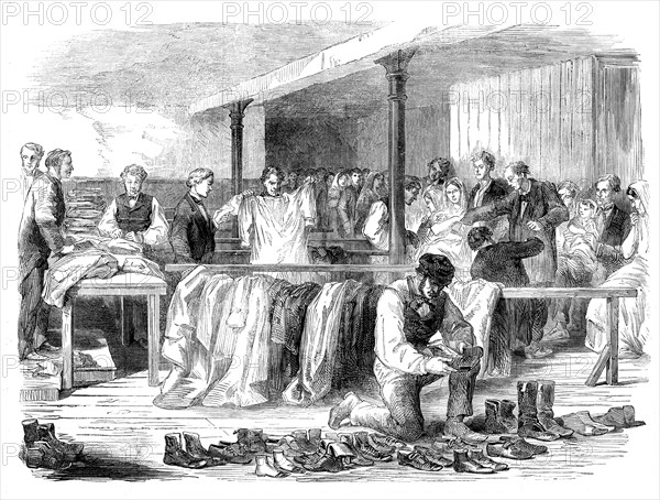The Cotton Famine: the Manchester and Salford Provident Society distributing clothing, 1862. Creator: Unknown.