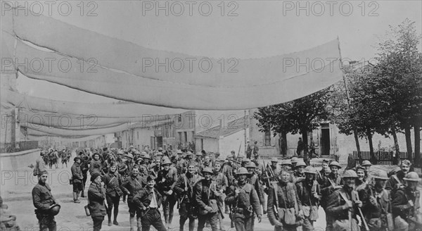 U.S. troops on camouflaged road, 11 May 1918. Creator: Bain News Service.