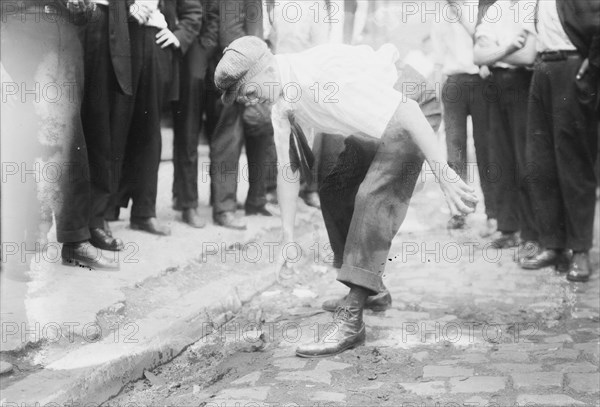 Bayonne picking up stones, between c1910 and c1915. Creator: Bain News Service.