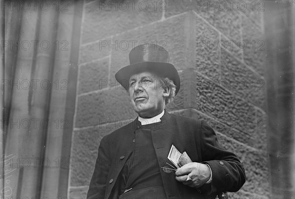 Bishop of Salisbury holding glasses and train schedule, 1910. Creator: Bain News Service.