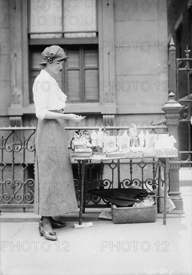 Selling medals etc. before St. Anne's, between c1910 and c1915. Creator: Bain News Service.