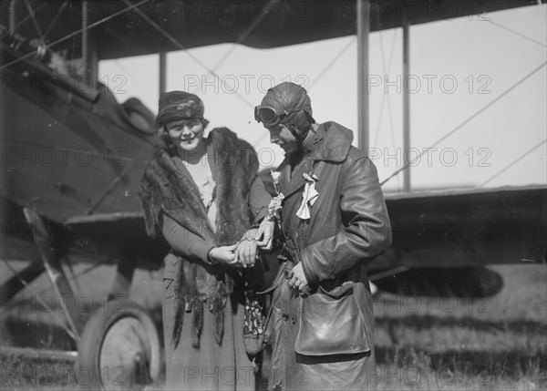 Claire Ogden, giving watch to Lieutenant W.C.F. Brown, between c1915 and c1920. Creator: Bain News Service.