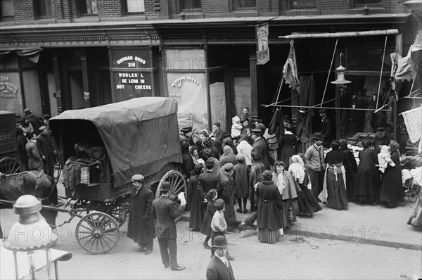 Crowd gathered in front of butcher shop during meat riot, New York, 1910. Creator: Bain News Service.