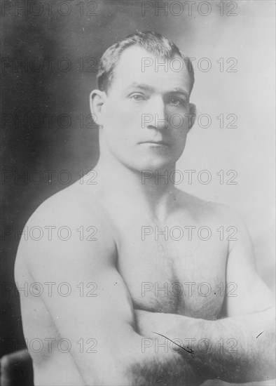 Tom Sharkey without shirt, 1910. Creator: Bain News Service.