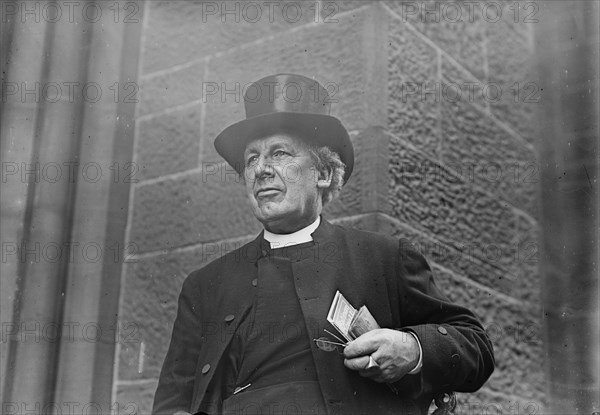 Bishop of Salisbury holding glasses and train schedule, 1910. Creator: Bain News Service.